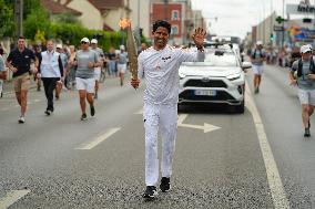 PARIS 2024 - Olympic Torch flame bearer Nasser Al-Khelaifi in Vigneux-sur-Seine