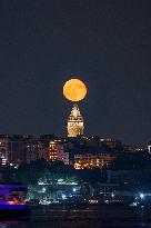 Moonrise Over Galata Tower Illuminates Istanbul's Night Sky