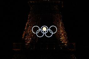 Paris 2024 - Full Moon Rises Behind Olympic Rings