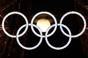 Paris 2024 - Full Moon Rises Behind Olympic Rings