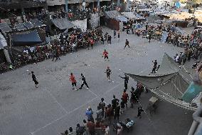 MIDEAST-GAZA-JABALIA REFUGEE CAMP-FOOTBALL GAME