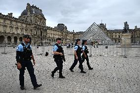 Paris 2024 - Police Patrol Near Louvres Museum