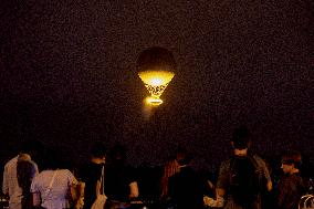 The Cauldron With The Olympic Flame Lit Flies Over Paris