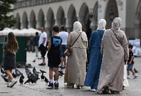 Crowd Of Middle Eastern Tourists In UNESCO Krakow