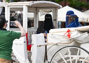 Crowd Of Middle Eastern Tourists In UNESCO Krakow