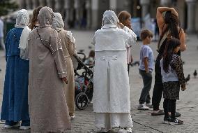 Crowd Of Middle Eastern Tourists In UNESCO Krakow