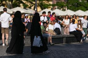 Crowd Of Middle Eastern Tourists In UNESCO Krakow