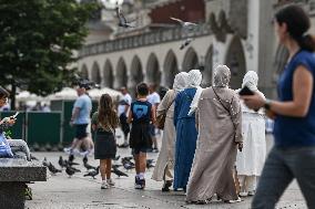 Crowd Of Middle Eastern Tourists In UNESCO Krakow