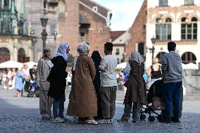 Crowd Of Middle Eastern Tourists In UNESCO Krakow