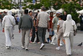 Crowd Of Middle Eastern Tourists In UNESCO Krakow