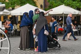 Crowd Of Middle Eastern Tourists In UNESCO Krakow