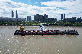 Swimmers Swim Across The Qiantang River in Hangzhou