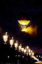 The Cauldron With The Olympic Flame Lit Flies Seen From The Louvre