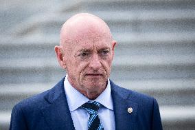 Potential Vice President nominee Sen. Mark Kelly speaks with reporters outside the Capitol