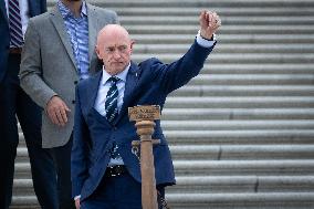 Potential Vice President nominee Sen. Mark Kelly speaks with reporters outside the Capitol