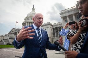 Potential Vice President nominee Sen. Mark Kelly speaks with reporters outside the Capitol