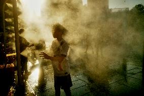 People Cool Off As Temperatures Rise In Paris