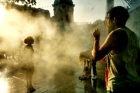 People Cool Off As Temperatures Rise In Paris