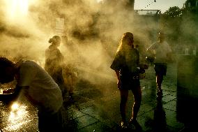 People Cool Off As Temperatures Rise In Paris