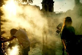 People Cool Off As Temperatures Rise In Paris