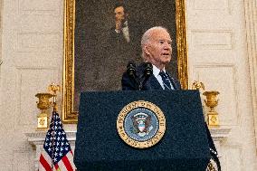 U.S. President Joe Biden stands with hostage familes the White House