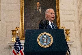 U.S. President Joe Biden stands with hostage familes the White House