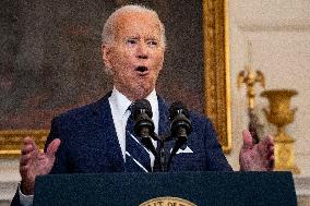 U.S. President Joe Biden stands with hostage familes the White House