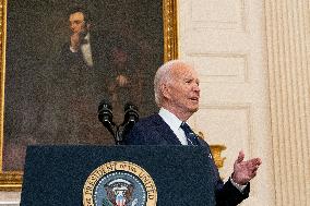 U.S. President Joe Biden stands with hostage familes the White House