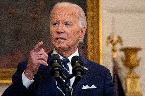 U.S. President Joe Biden stands with hostage familes the White House