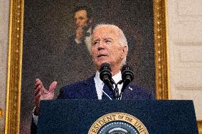 U.S. President Joe Biden stands with hostage familes the White House