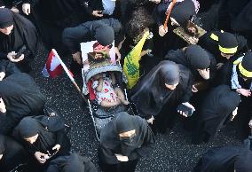 Hezbollah Fighters and Mourners Attend Funeral of Top Commander Fuad Shukr in Beirut