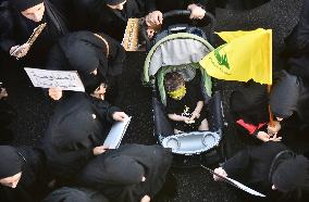 Hezbollah Fighters and Mourners Attend Funeral of Top Commander Fuad Shukr in Beirut