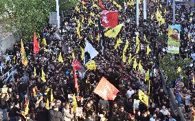 Hezbollah Fighters and Mourners Attend Funeral of Top Commander Fuad Shukr in Beirut