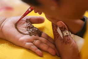 Nepali Hindu Women Apply Mehendi at Kathmandu Fair as Part of Sacred Shrawan Ritual