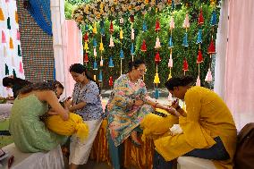 Nepali Hindu Women Apply Mehendi at Kathmandu Fair as Part of Sacred Shrawan Ritual