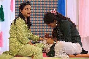 Nepali Hindu Women Apply Mehendi at Kathmandu Fair as Part of Sacred Shrawan Ritual