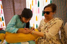 Nepali Hindu Women Apply Mehendi at Kathmandu Fair as Part of Sacred Shrawan Ritual