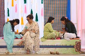 Nepali Hindu Women Apply Mehendi at Kathmandu Fair as Part of Sacred Shrawan Ritual