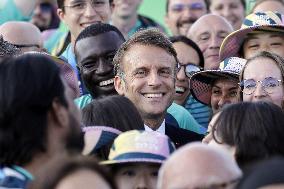 Emmanuel Macron meets volonteers during archery competitions at Invalides