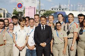 Emmanuel Macron meets volonteers during archery competitions at Invalides