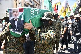 Members of the Palestinian Joint Action Committee Hold Rally and Symbolic Funeral for Late Hamas Leader Ismail Haniyeh In Beirut