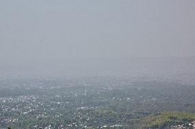 Smog Caused From Active Forest Fires Obscures The Town Of Dehradun