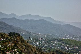 Smog Caused From Active Forest Fires Obscures The Town Of Dehradun