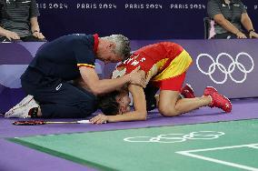 Paris 2024 - Carolina Marin of Spain suffers an injury during badminton women's singles