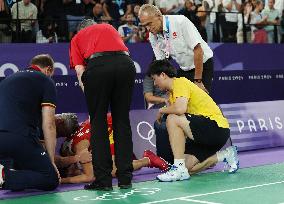 Paris 2024 - Carolina Marin of Spain suffers an injury during badminton women's singles