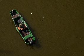 Fisherman Fishes In The Vistula River.