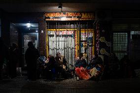 Pilgrims Wait To Enter The Church Of San Cayetano, In Liniers, A Working Class Neighbourhood Of Buenos Aires