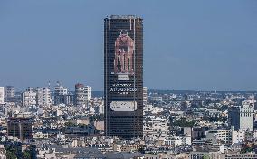 Paris 2024 - Giant Image Of Superstar Leon Marchand Diplayed On The Tour Montparnasse