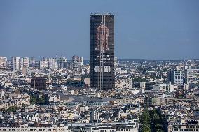 Paris 2024 - Giant Image Of Superstar Leon Marchand Diplayed On The Tour Montparnasse