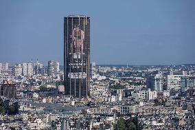 Paris 2024 - Giant Image Of Superstar Leon Marchand Diplayed On The Tour Montparnasse